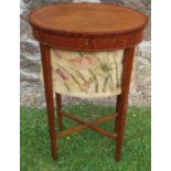 A 19th century satinwood oval sewing table, with tapestry basket, raised on square tapering legs