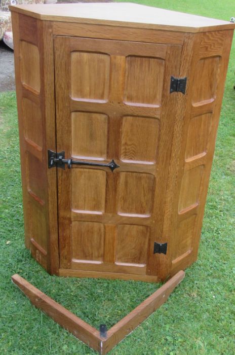 Wilf Squirrel Man Hutchinson, an oak corner cabinet, with panelled door, width 27.5ins, height 36.