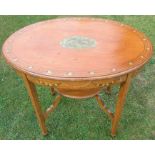 An Edwardian satinwood oval occasional table, decorated to the top and frieze with putti and
