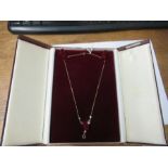 A 9 carat gold amethyst and diamond pendant necklace, in an Elizabeth Duke case