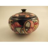 A Moorcroft covered bowl, decorated in the Hera pattern, height 4ins - good condition