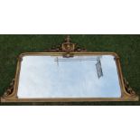 A gilt framed over mantel mirror, of rectangular form, with scroll and leaf decoration, overall