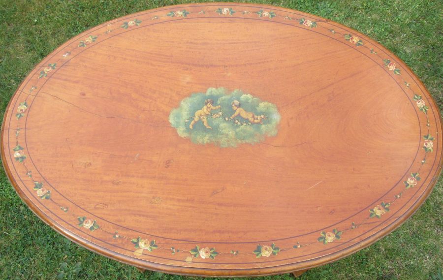 An Edwardian satinwood oval occasional table, decorated to the top and frieze with putti and - Image 2 of 4