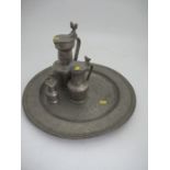 A large pewter charger, with touch marks to the inside of the rim, diameter 18ins, together with