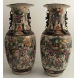 A pair of Chinese crackle glaze vases, decorated with warriors and moulded animals, af, height 18ins