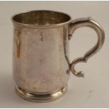 An 18th century silver mug, engraved with a crest, the base with initials, name and date, London