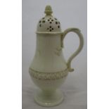 An 18th century Leeds creamware sugar caster, of baluster form, with acorn finial, scroll handle,