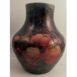 A large Moorcroft vase, decorated in the Finches and Fruit pattern, height 13ins crazing to both the