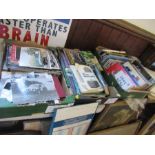 Three boxes of motor racing books and ephemera, including photographs