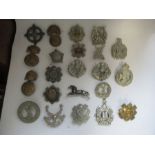 A quantity of British infantry military badges, predominantly from Scottish regiments, including