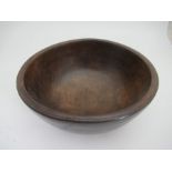 A 19th century turned wood dairy bowl, diameter 14ins