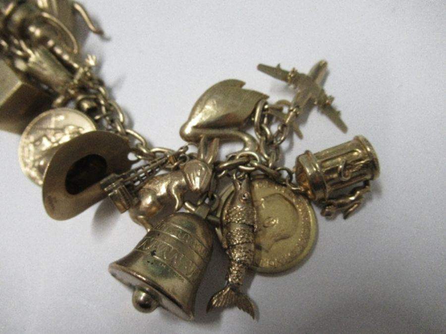 Nineteen hallmarked gold charms, three yellow metal charms, a 1912 heart sovereign and mount, all on - Image 2 of 6