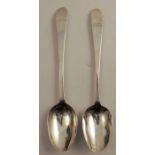 A pair of Irish mid 18th century silver serving spoons, engraved with a crest, Dublin 1790, weight