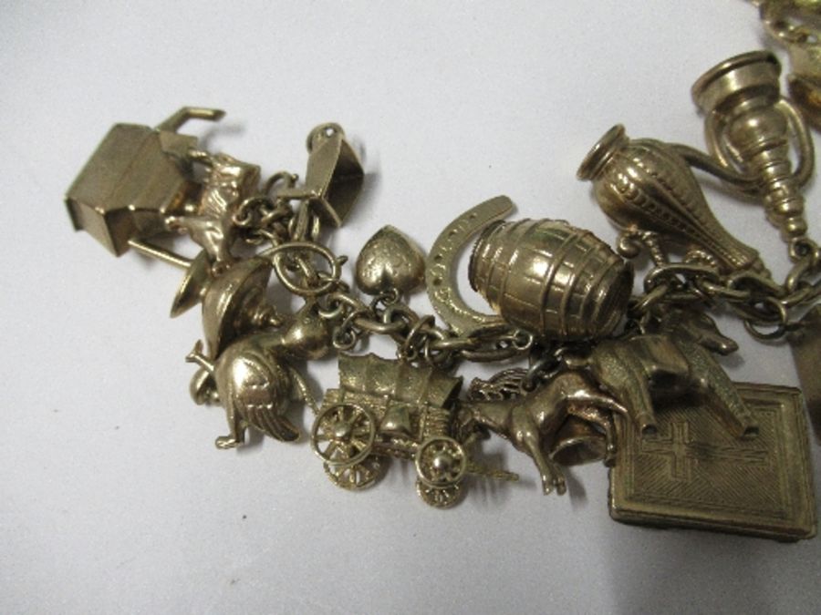 Nineteen hallmarked gold charms, three yellow metal charms, a 1912 heart sovereign and mount, all on - Image 4 of 6
