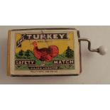 A Japanese wind up musical mechanism, playing jingle bells, in a The Turkey Safety Matches box