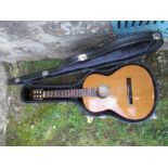 A classical Spanish guitar, by Manuel Rodriguez, Model C1, in hard case