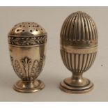 Two Victorian silver pepper pot, on with classical decoration, the other with gadrooned, both on
