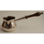 An 18th century silver brandy warming pan, with turned wooden handle, engraved with a crest,