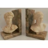 A pair of 20th century bookends, formed as classical busts on marble stands, height 6ins