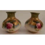 A pair of Royal Worcester vases, decorated with roses to the quarter lobed body, shape number