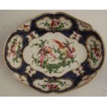 A 19th century Samson of Paris porcelain shaped oval dish, decorated with reserves of fabulous birds