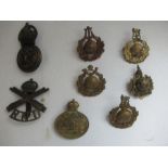 A collection of military badges, to include five Royal Marine, together with Naval Air Service,