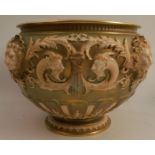 A Royal Worcester jardiniere, heavily moulded with classical motifs and masks, height 7ins, diameter