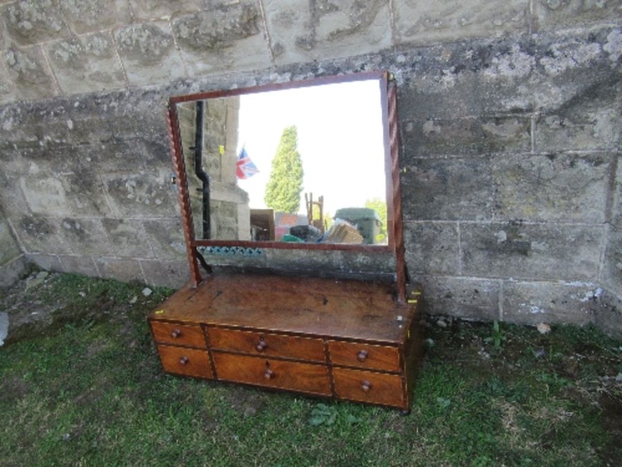 A large 19th century mahogany swing frame toilet mirror, the base fitted with two long central