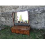 A large 19th century mahogany swing frame toilet mirror, the base fitted with two long central