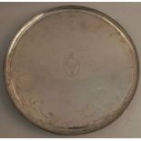 A Georgian silver salver, of circular form with beaded edge, raised on four beaded bracket supports,