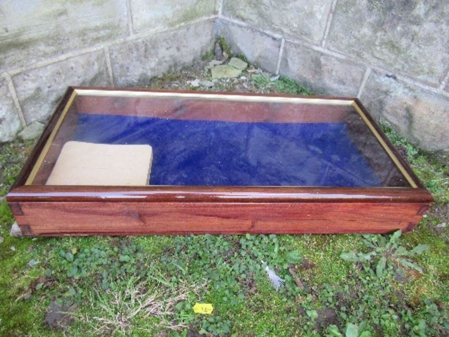 A mahogany framed table top glazed display cabinet, with rising lid, 12ins x 24ins x height 4ins