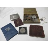 A quantity of coins, a hallmarked silver cigarette box, a silver mounted leather cigarette case, a