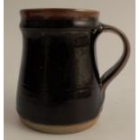 A Winchcombe Pottery mug, by Michael Cardew, impressed Winchcombe seal mark, incised C to base,