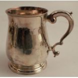 An 18th century silver mug, of baluster form, London 1735, maker Francis Spilsbury I, weight 9oz,