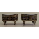 A pair of 19th century pierced silver oval salts, with engraved decoration, raised on four feet,