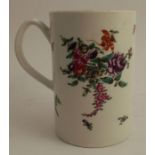 An 18th century tankard, decorated with coloured flowers, height 6ins no obvious signs of damage