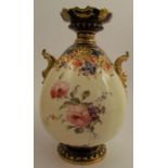 A Royal Crown Derby vase, decorated with flowers to a cream ground, with gilt handles and