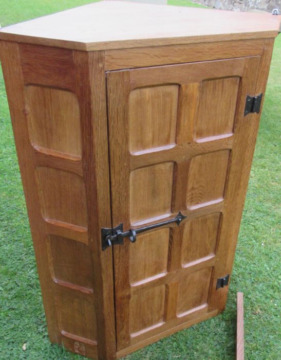 Wilf Squirrel Man Hutchinson, an oak corner cabinet, with panelled door, width 27.5ins, height 36. - Image 2 of 4