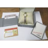 Omega, De Ville, a lady's two colour bracelet quartz watch, with case, box and paperwork, case