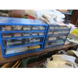 Two table top cabinets with drawers, containing a large quantity of watch making and repair