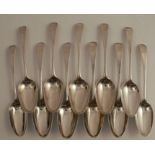 A set of eleven mid 18th century silver serving spoons, engraved with a crest, bottom marked, London