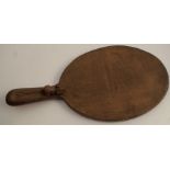 A Robert Mouseman Thompson oak oval cheese board, carved with a mouse to the handle, 15ins x 7ins