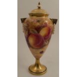 A Royal Worcester covered pedestal vase, decorated all around with fruit to a mossy background by