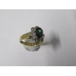 An 18 carat gold green tourmaline and diamond cluster ring, finger size K, 3.9g gross