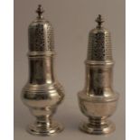 Two Georgian silver casters, one of baluster form on a circular pedestal foot, the other of