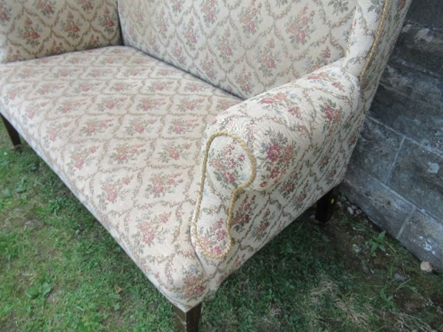 A high backed wing back two seater settee, the floral upholstery, width 53ins x height 47ins - Image 4 of 5