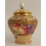 A Royal Worcester covered vase, decorated all around with fruit to a mossy background, signed, shape