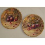 Two Royal Worcester cabinet plates, decorated with fruit to a mossy background by H H Price, both