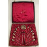 A cased set of French twelve silver teaspoons, together with matching sugar tongs and tea