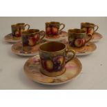 A set of six Royal Worcester coffee cans and saucers, all decorated all around with fruit to a mossy